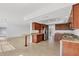 Open kitchen with granite countertops, stainless steel appliances, and tiled flooring at 6637 Bowline Dr, Sarasota, FL 34231