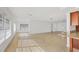 Open living space features bright white walls, tile floors, and large windows for natural light at 6637 Bowline Dr, Sarasota, FL 34231