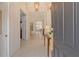 Elegant foyer with tile flooring, a chandelier, and an open view to the living areas at 7137 Orchid Island Pl, Bradenton, FL 34202