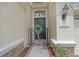 Welcoming entrance featuring a decorative wreath and a charming black gate at 7137 Orchid Island Pl, Bradenton, FL 34202