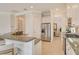 Well-lit kitchen featuring breakfast bar, stainless steel appliances, and an eat-in kitchen nook at 7137 Orchid Island Pl, Bradenton, FL 34202
