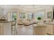Bright living room with easy access to the screened lanai and a stylish breakfast bar at 7137 Orchid Island Pl, Bradenton, FL 34202