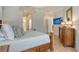 Spacious main bedroom with wood floors and a flat-screen TV on the wall at 7137 Orchid Island Pl, Bradenton, FL 34202