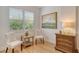 Cozy sitting room with natural light, wood floors, plantation shutters, and wooden furniture at 7137 Orchid Island Pl, Bradenton, FL 34202