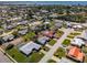 Aerial shot of a neighborhood with a home featuring an in-ground pool and a spacious yard at 7307 14Th W Ave, Bradenton, FL 34209