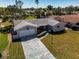 An aerial view of a charming single-story home with an attached one car garage and driveway at 7307 14Th W Ave, Bradenton, FL 34209