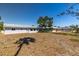 Sprawling backyard with ample space and a view of the home and screened-in patio at 7307 14Th W Ave, Bradenton, FL 34209