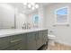Bathroom featuring a green vanity with gold hardware, a white countertop, and a window at 7307 14Th W Ave, Bradenton, FL 34209