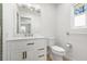 Bathroom vanity features bronze fixtures, white cabinets, and a quartz countertop at 7307 14Th W Ave, Bradenton, FL 34209