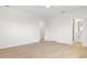 Spacious bedroom with light wood floors, white walls and access to ensuite bathroom at 7307 14Th W Ave, Bradenton, FL 34209