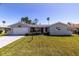 Charming single-story home with a well-manicured lawn and attached one car garage at 7307 14Th W Ave, Bradenton, FL 34209
