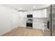 Bright kitchen featuring white cabinets, stainless steel appliances, and tile backsplash at 7307 14Th W Ave, Bradenton, FL 34209