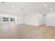 Spacious living room features wood-look tile flooring, neutral walls and lots of natural light at 7307 14Th W Ave, Bradenton, FL 34209