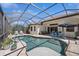 Screened-in pool area with an outdoor seating and dining area at 7324 Riviera Cv, Lakewood Ranch, FL 34202