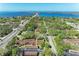 Stunning aerial view of condo complex near ocean and bridge, surrounded by lush greenery and a tranquil setting at 7615 4Th W Ave # 7615, Bradenton, FL 34209