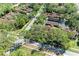 A scenic aerial view of the property showcases mature landscaping and tree-lined streets in a tranquil neighborhood at 7615 4Th W Ave # 7615, Bradenton, FL 34209