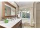 Well-lit bathroom showcasing a vanity, tub, and natural light at 7615 4Th W Ave # 7615, Bradenton, FL 34209