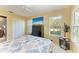 Bright bedroom features a large closet, natural light, and a ceiling fan at 7615 4Th W Ave # 7615, Bradenton, FL 34209