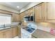 Updated kitchen with modern appliances, granite counters, and ample cabinet space at 7615 4Th W Ave # 7615, Bradenton, FL 34209
