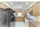 Well-equipped kitchen featuring stainless steel appliances and granite countertops at 7615 4Th W Ave # 7615, Bradenton, FL 34209