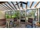 Inviting screened-in lanai with tile flooring and outdoor seating, perfect for enjoying the serene views at 7615 4Th W Ave # 7615, Bradenton, FL 34209