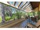 Relaxing screened-in lanai with comfortable seating and views of the lush, mature landscaping at 7615 4Th W Ave # 7615, Bradenton, FL 34209