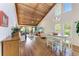 Spacious open concept living room with vaulted wood ceilings and views of the screened-in lanai at 7615 4Th W Ave # 7615, Bradenton, FL 34209