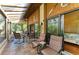 Enclosed patio with comfortable seating, perfect for outdoor relaxation at 7615 4Th W Ave # 7615, Bradenton, FL 34209