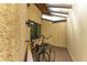 Outdoor storage area with bicycles and a surfboard at 7615 4Th W Ave # 7615, Bradenton, FL 34209