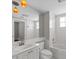 Bright bathroom featuring a large mirror, modern fixtures, and a bathtub at 7665 Bergamo Ave, Sarasota, FL 34238