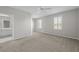 Spacious main bedroom with neutral tones, plush carpet, and ample natural light at 7665 Bergamo Ave, Sarasota, FL 34238