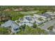 An aerial view shows this luxury home is nestled on a golf course within a beautiful community at 7782 Club Ln, Sarasota, FL 34238