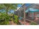 View of back screened in patio with view of golf course at 7782 Club Ln, Sarasota, FL 34238