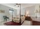 A traditional bedroom is complemented with a dark wood four-post bed and a classic chair at 7782 Club Ln, Sarasota, FL 34238