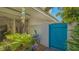 Charming gated courtyard featuring a small fountain and lush tropical landscaping at 7782 Club Ln, Sarasota, FL 34238