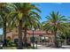Community entrance with palm trees and decorative gate at 7782 Club Ln, Sarasota, FL 34238
