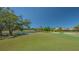 Expansive golf course views with a tranquil pond, offering a serene and picturesque backdrop for luxury homes at 7782 Club Ln, Sarasota, FL 34238