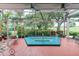 A relaxing hot tub enclosed in a screened lanai provides a serene and private outdoor experience at 7782 Club Ln, Sarasota, FL 34238