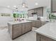 A spacious kitchen with custom cabinets, a large island, and stainless steel appliances at 7782 Club Ln, Sarasota, FL 34238
