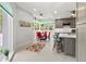 Bright eat-in kitchen featuring a breakfast bar, stainless hood, and breakfast nook with bright windows at 7782 Club Ln, Sarasota, FL 34238