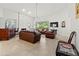 Spacious living room with a fireplace, high ceilings and lots of natural light at 7782 Club Ln, Sarasota, FL 34238