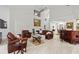 Spacious living room features high ceilings, bar and comfortable seating area at 7782 Club Ln, Sarasota, FL 34238