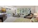 Bright bedroom with large windows, workspace, and a luxurious massage chair at 7782 Club Ln, Sarasota, FL 34238