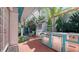 Covered outdoor kitchen with stainless steel appliances and ample counter space for entertaining at 7782 Club Ln, Sarasota, FL 34238