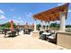 Covered outdoor patio seating area with golf course views is perfect for relaxing or entertaining at 7782 Club Ln, Sarasota, FL 34238