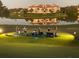 Live band performing outdoors by the lake, with a luxury building in the background at 8024 Via Fiore, Sarasota, FL 34238