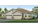 Charming single-story home featuring a two-car garage, neutral paint and stone accents at 808 157Th E Ct, Bradenton, FL 34212