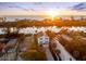 Stunning aerial view of the home at sunset, showcasing the waterfront location and neighborhood at 8258 Midnight Pass Rd, Sarasota, FL 34242