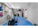 Finished basement with rubber flooring, golf clubs, and workout equipment at 8258 Midnight Pass Rd, Sarasota, FL 34242