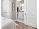 Bathroom with a white vanity, round mirror, and access from the bedroom at 8258 Midnight Pass Rd, Sarasota, FL 34242
